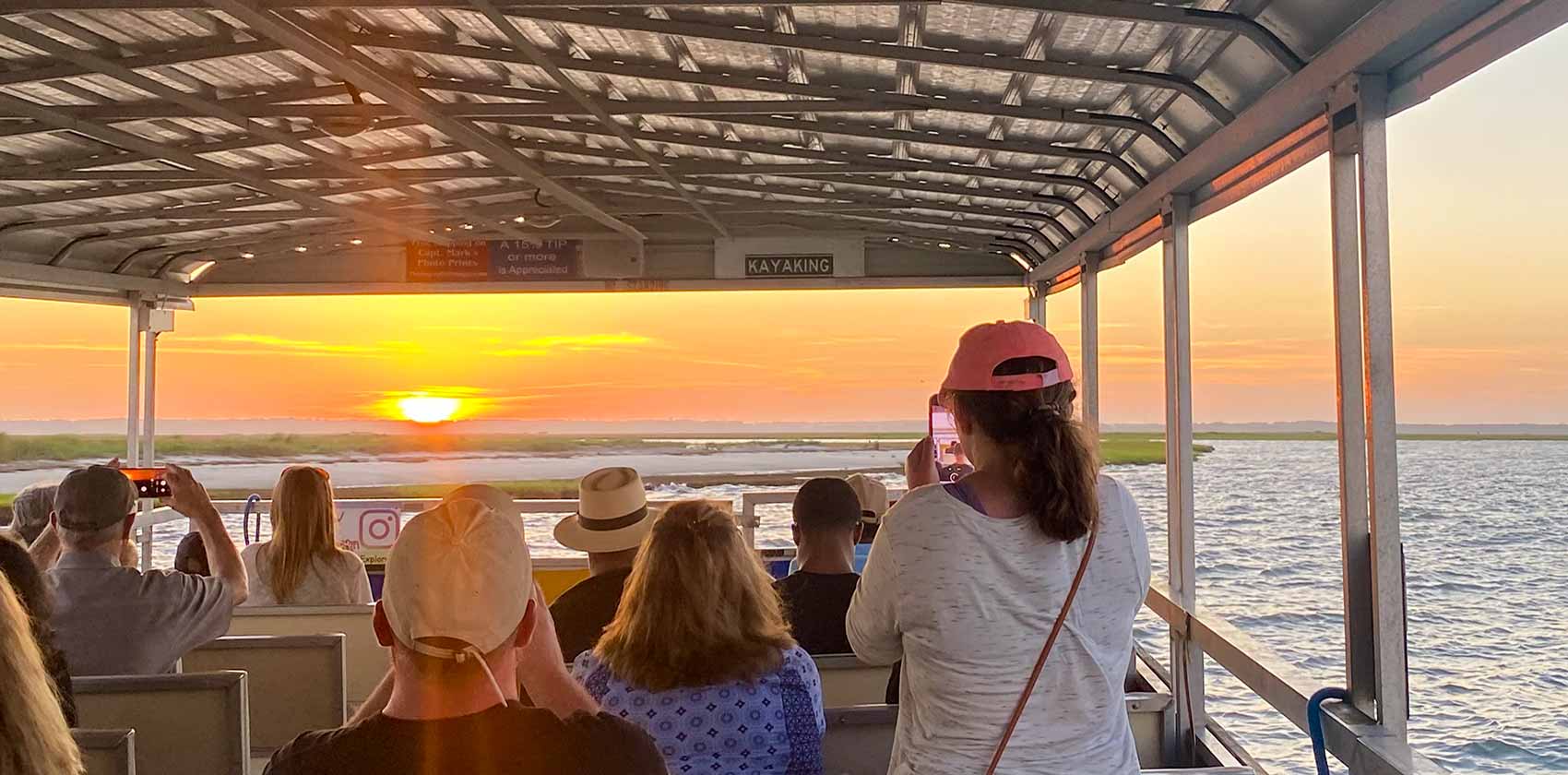 Visitors enjoying sunset on Assateague Explorer sunset cruise